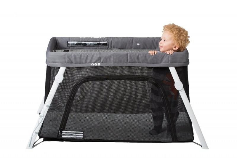 a kid playing in a comfortable playard